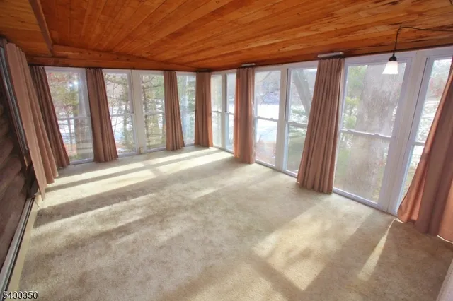 a view of an empty room with a balcony
