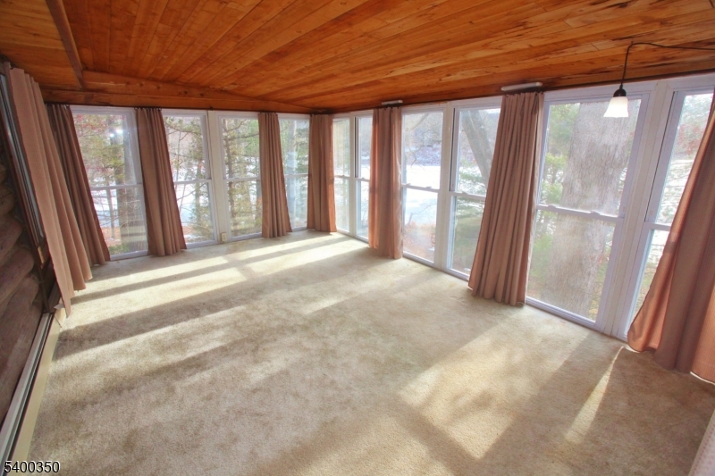 22 Choctaw Oak Ridge Oak Ridge, NJ 07438 - Photo 8 of 23 a view of an empty room with a balcony