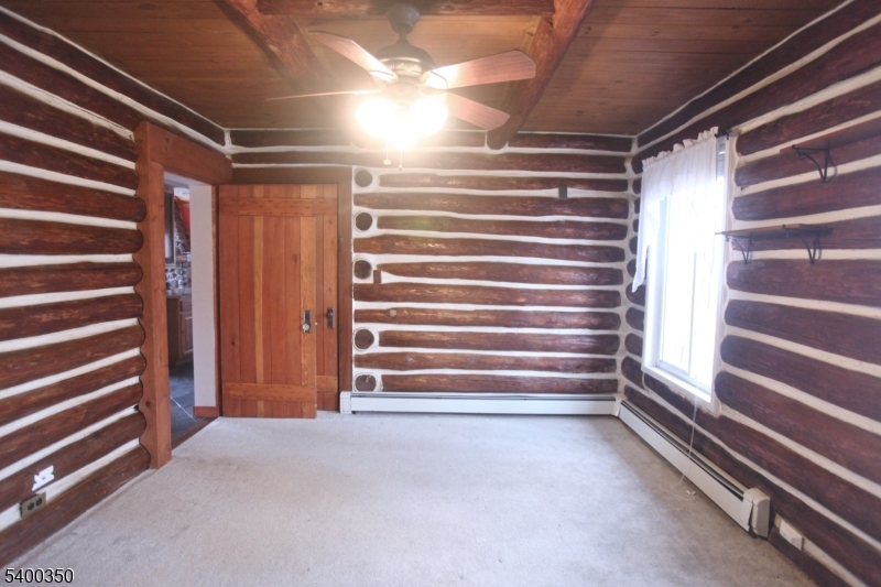 22 Choctaw Oak Ridge Oak Ridge, NJ 07438 - Photo 9 of 23 a view of walk in closet with empty racks