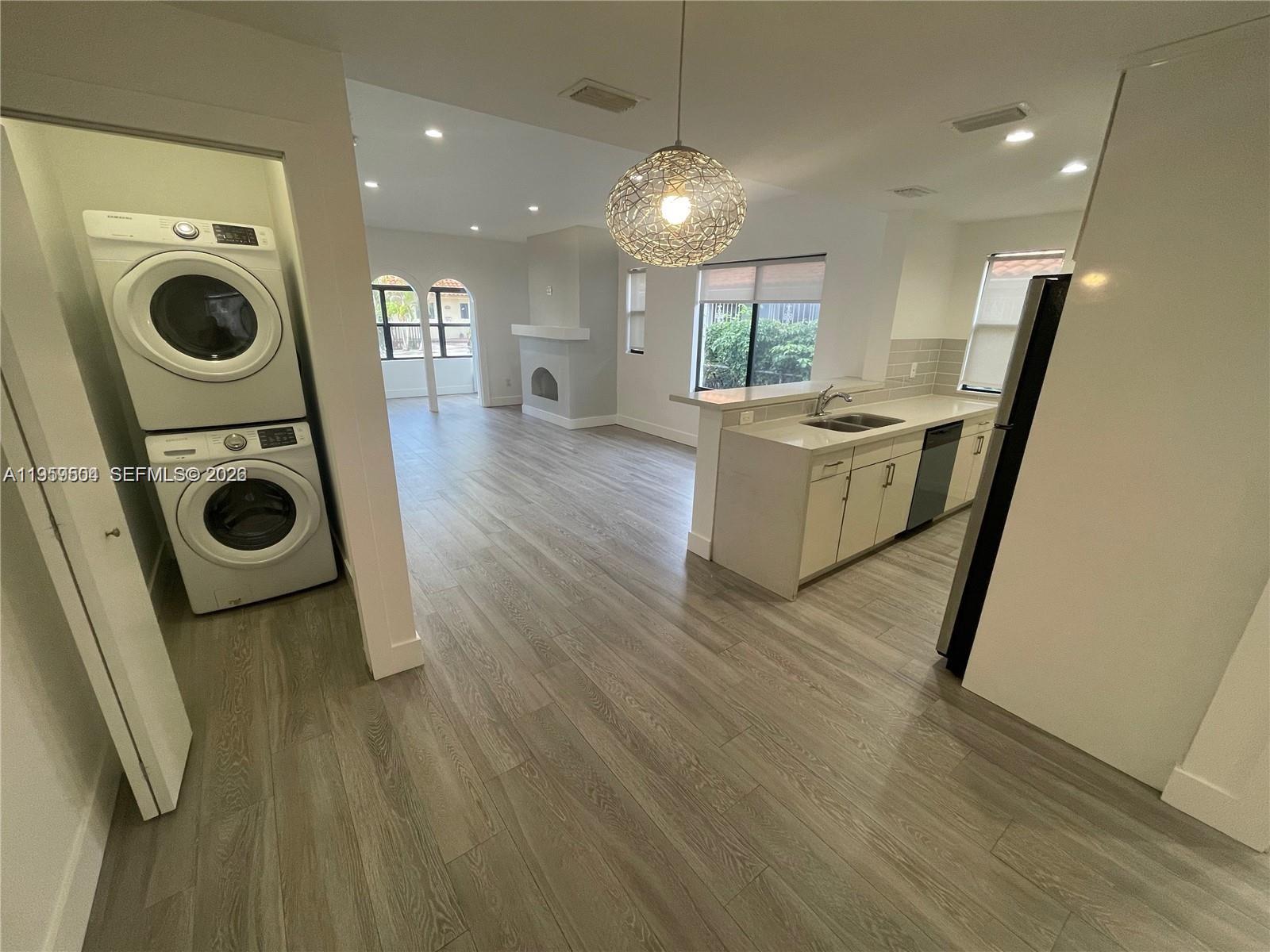 1637 Southwest 10th Street, Unit 2 Miami, FL 33135 - Photo 5 of 9 a view of kitchen and washer and dryer