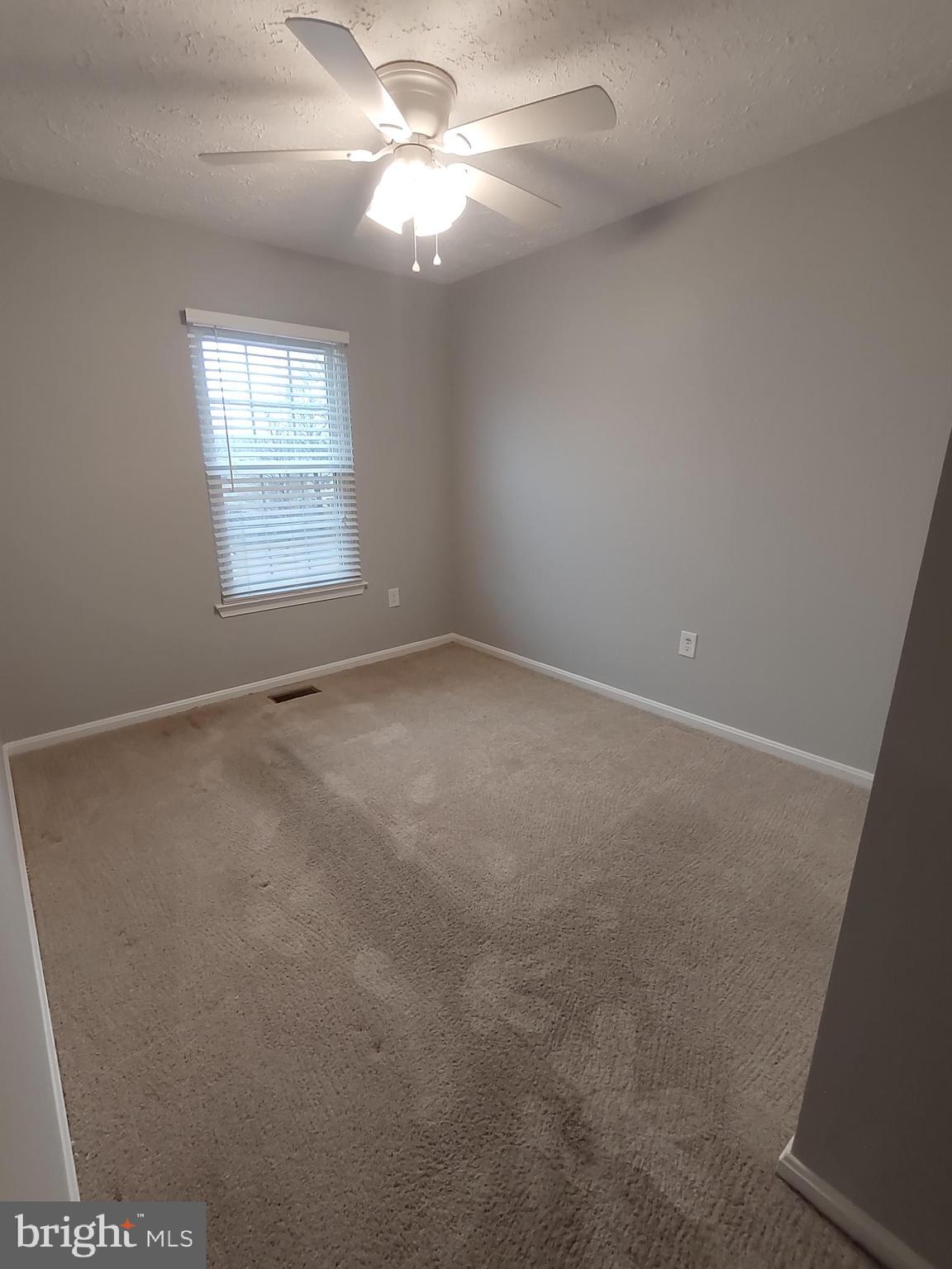 11235 Kettering Place Upper Marlboro, MD 20774 - Photo 13 of 22 an empty room with windows and fan