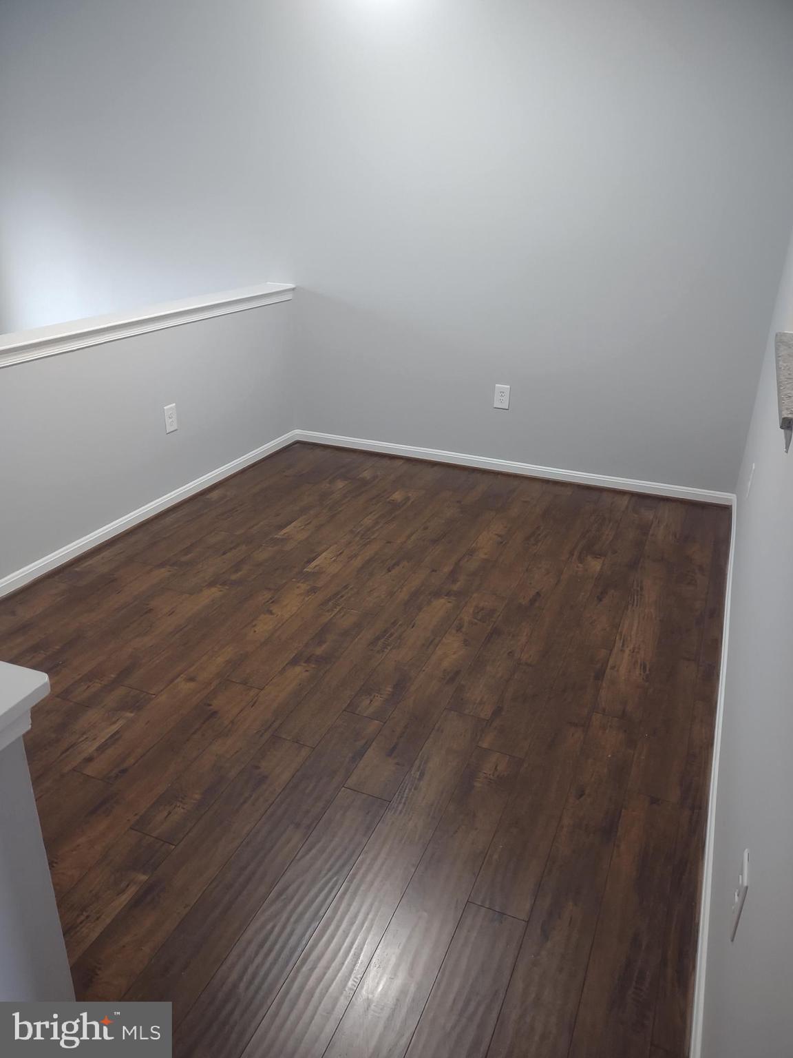 11235 Kettering Place Upper Marlboro, MD 20774 - Photo 16 of 22 an empty room with wooden floor