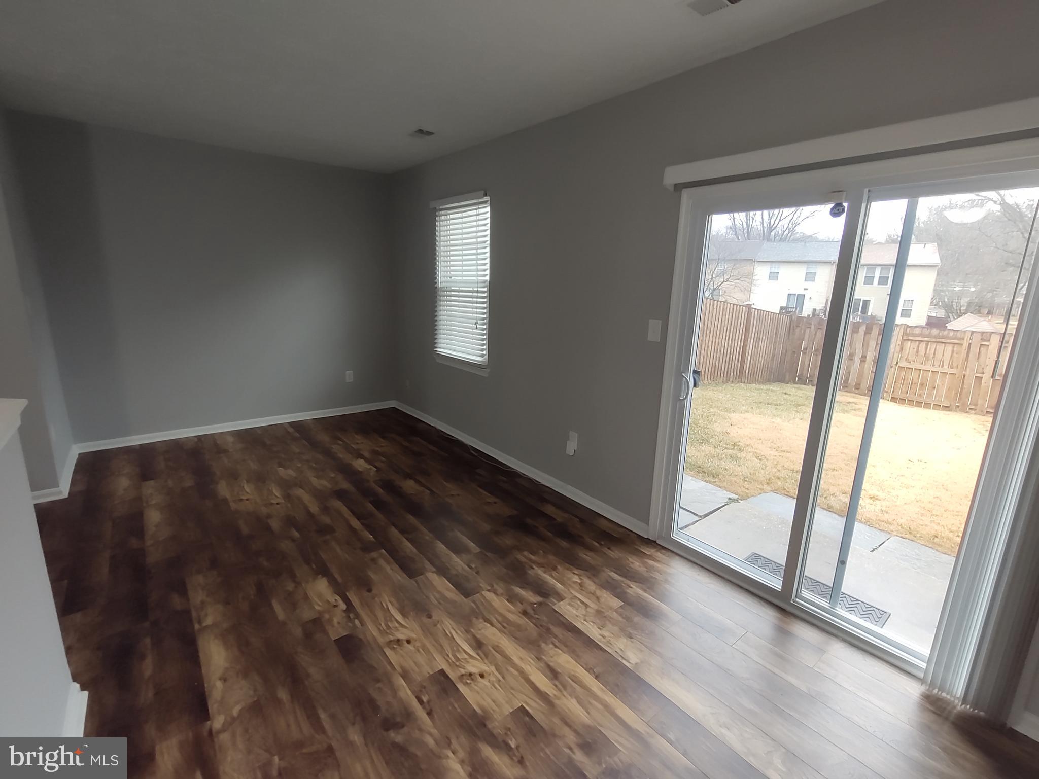 11235 Kettering Place Upper Marlboro, MD 20774 - Photo 17 of 22 a view of an empty room and wooden floor