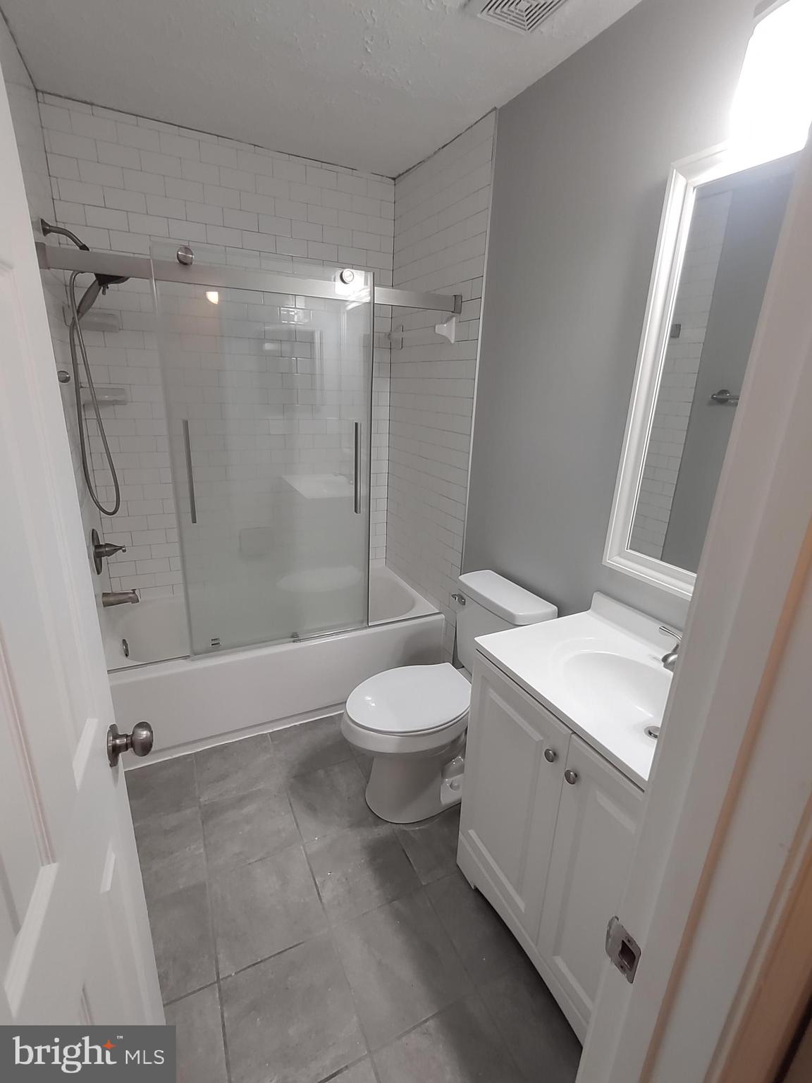 11235 Kettering Place Upper Marlboro, MD 20774 - Photo 9 of 22 a bathroom with a toilet a sink and shower