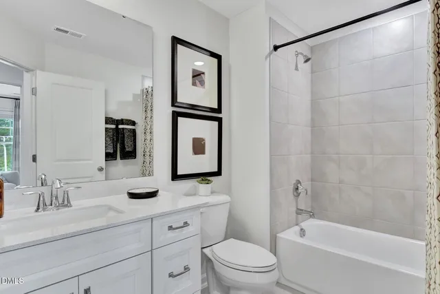 a bathroom with a sink vanity and a mirror