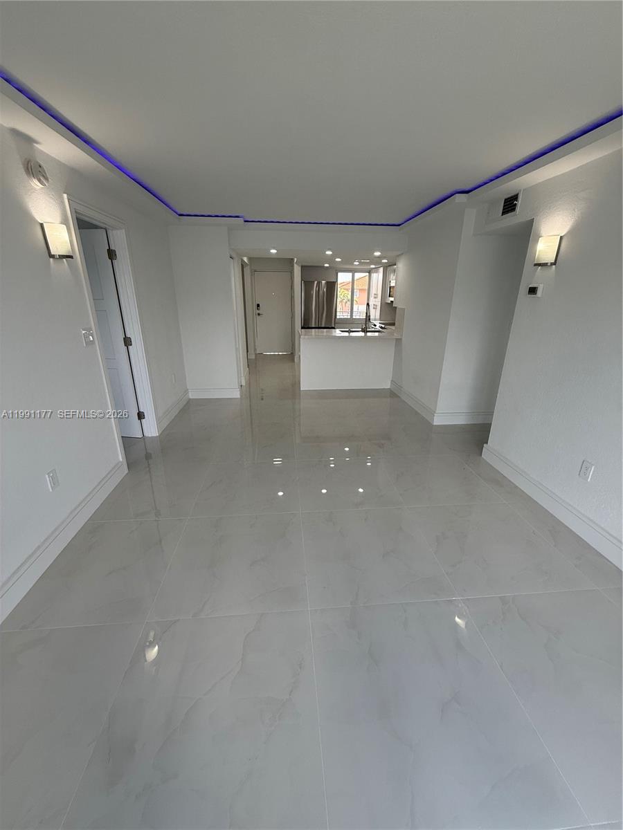 9915 West Okeechobee Road, Unit 2201 Hialeah Gardens, FL 33016 - Photo 4 of 11 a view of empty room with windows