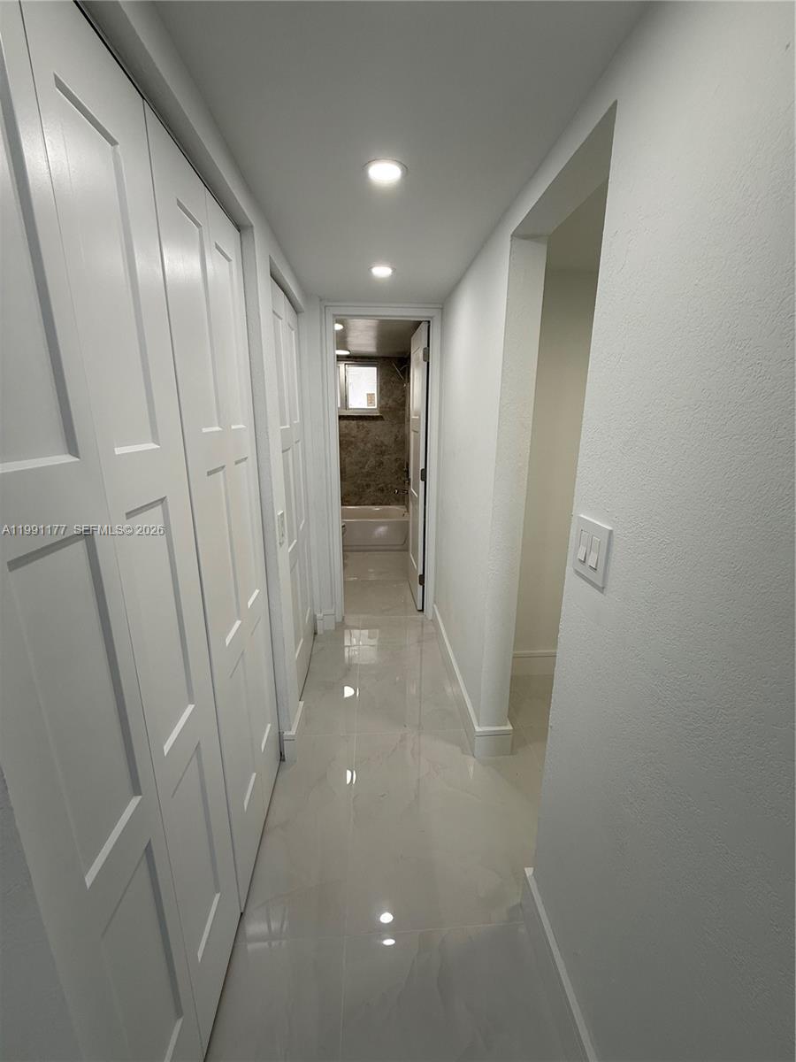 9915 West Okeechobee Road, Unit 2201 Hialeah Gardens, FL 33016 - Photo 7 of 11 a view of hallway