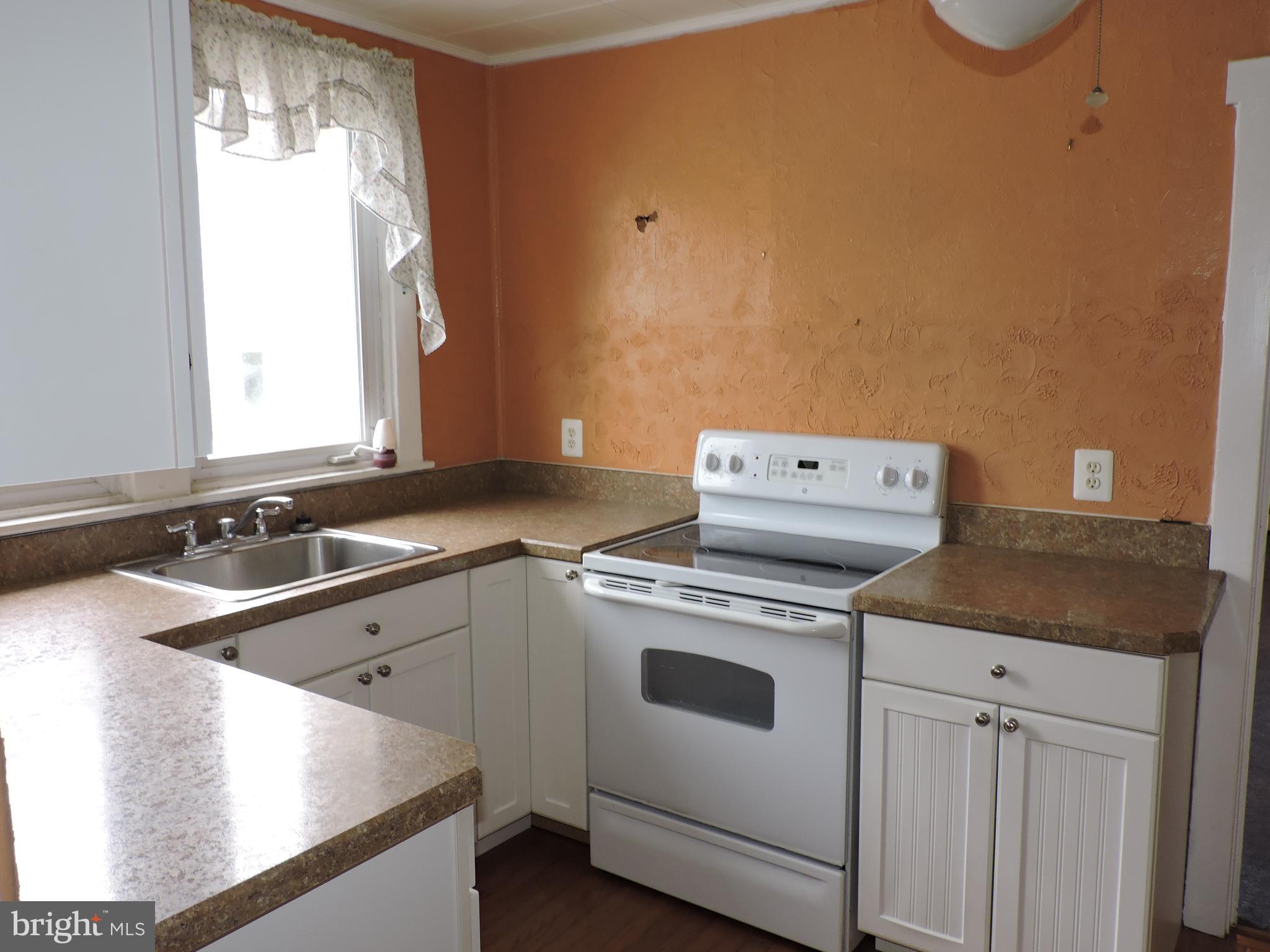 1116 Maple Street Conshohocken, PA 19428 - Photo 24 of 42 a kitchen with a stove and a sink