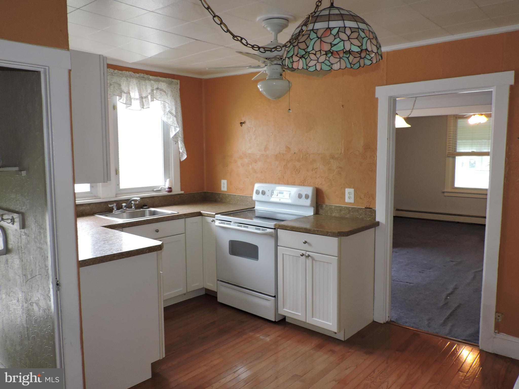1116 Maple Street Conshohocken, PA 19428 - Photo 25 of 42 a kitchen with stainless steel appliances granite countertop a sink and a stove top oven