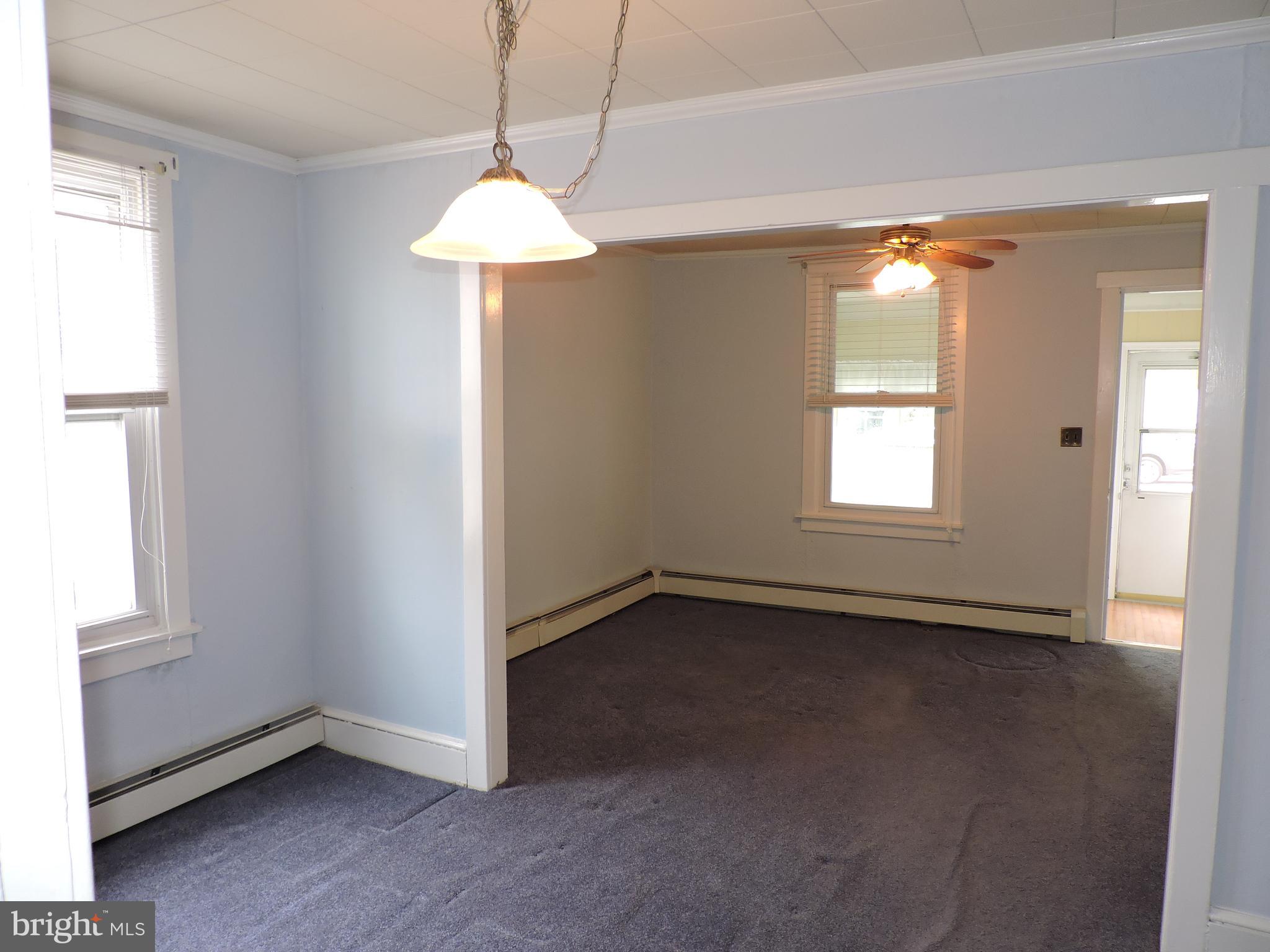 1116 Maple Street Conshohocken, PA 19428 - Photo 37 of 42 an empty room with a windows and chandelier fan