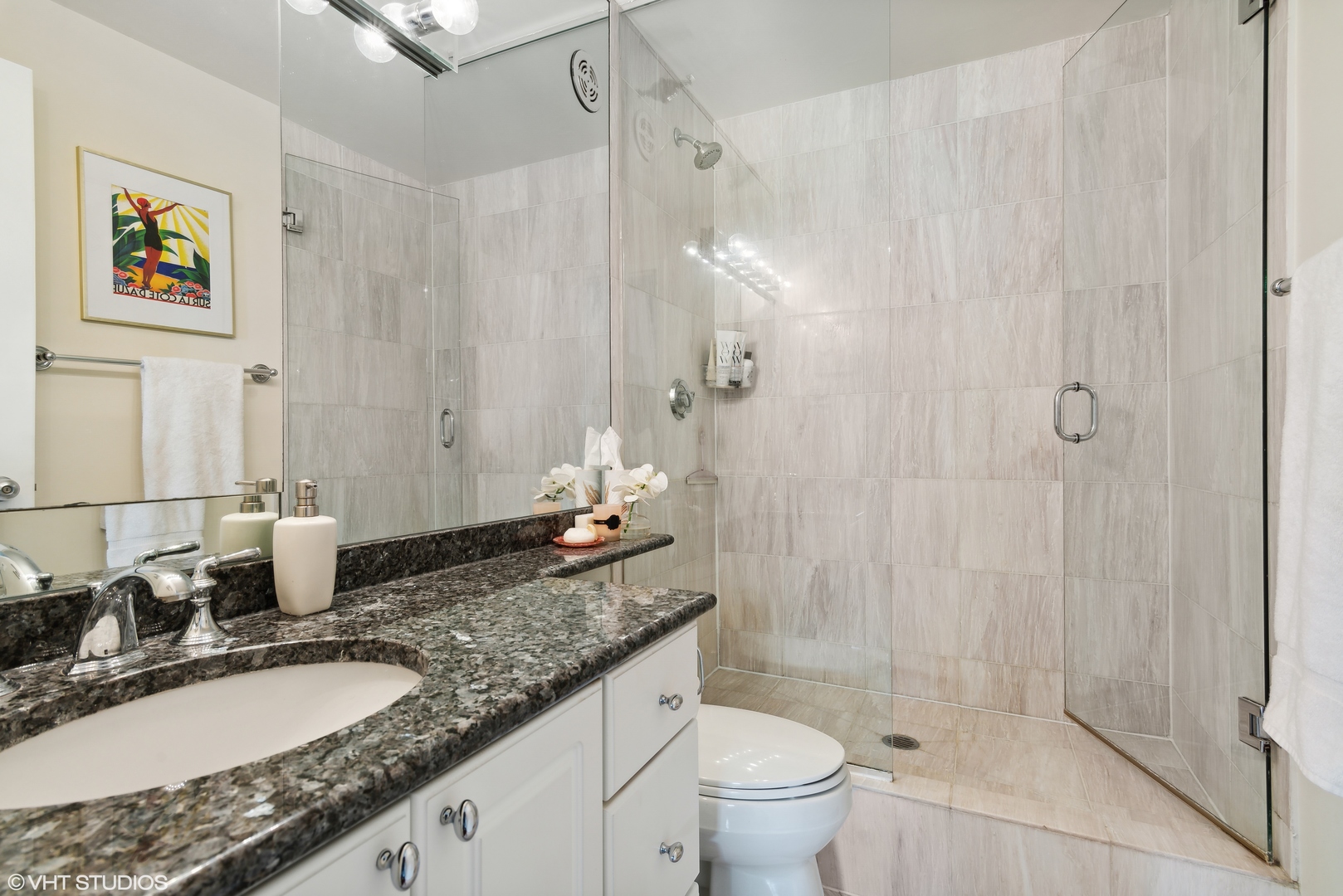 1122 North Clark Street, Unit 3401 Chicago, IL 60610 - Photo 11 of 26 a bathroom with a granite countertop sink a toilet and a shower