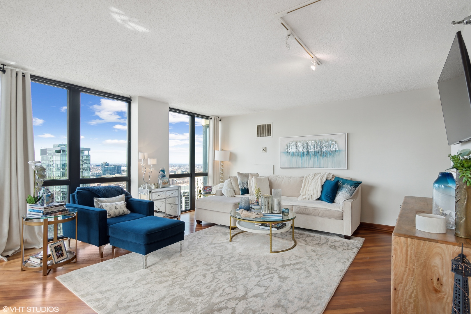 1122 North Clark Street, Unit 3401 Chicago, IL 60610 - Photo 4 of 26 a living room with furniture and large windows