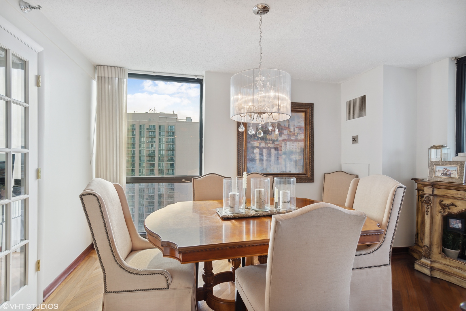 1122 North Clark Street, Unit 3401 Chicago, IL 60610 - Photo 7 of 26 a view of a dining room with furniture window and outside view
