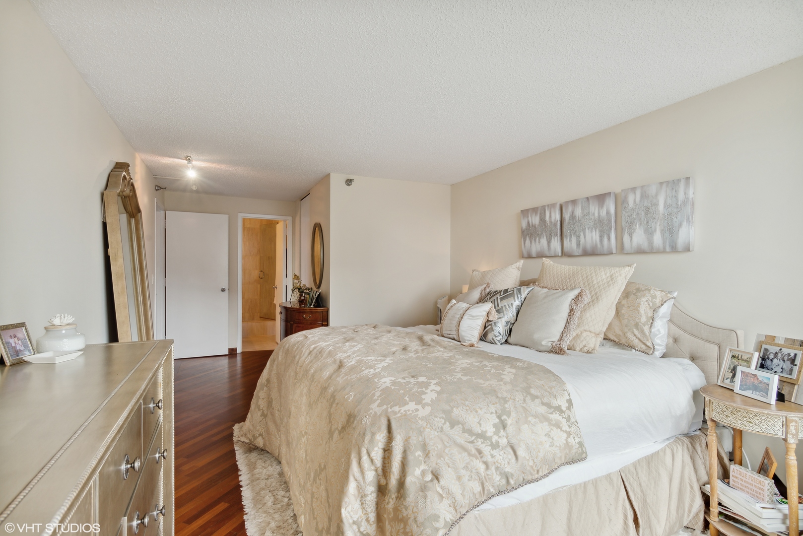 1122 North Clark Street, Unit 3401 Chicago, IL 60610 - Photo 10 of 26 a large white bed in a white room