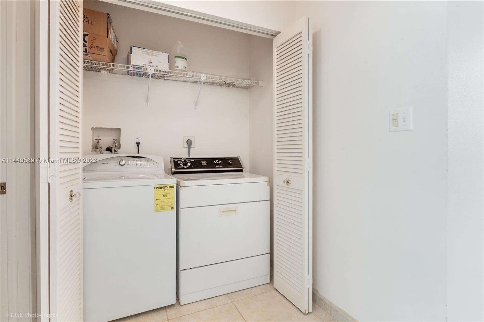 9208 Southwest 132nd Street Miami, FL 33176 - Photo 12 of 15 a utility room with cabinets washer and dryer