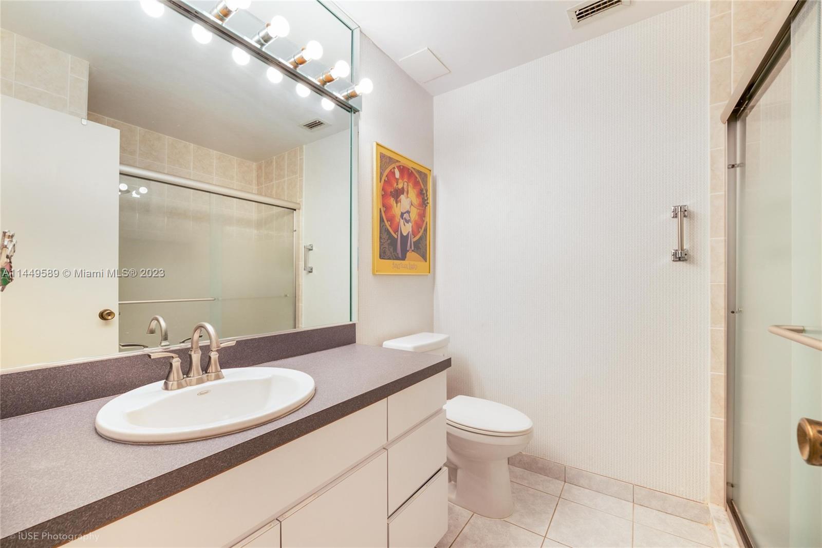 9208 Southwest 132nd Street Miami, FL 33176 - Photo 7 of 15 a bathroom with a toilet a sink and mirror