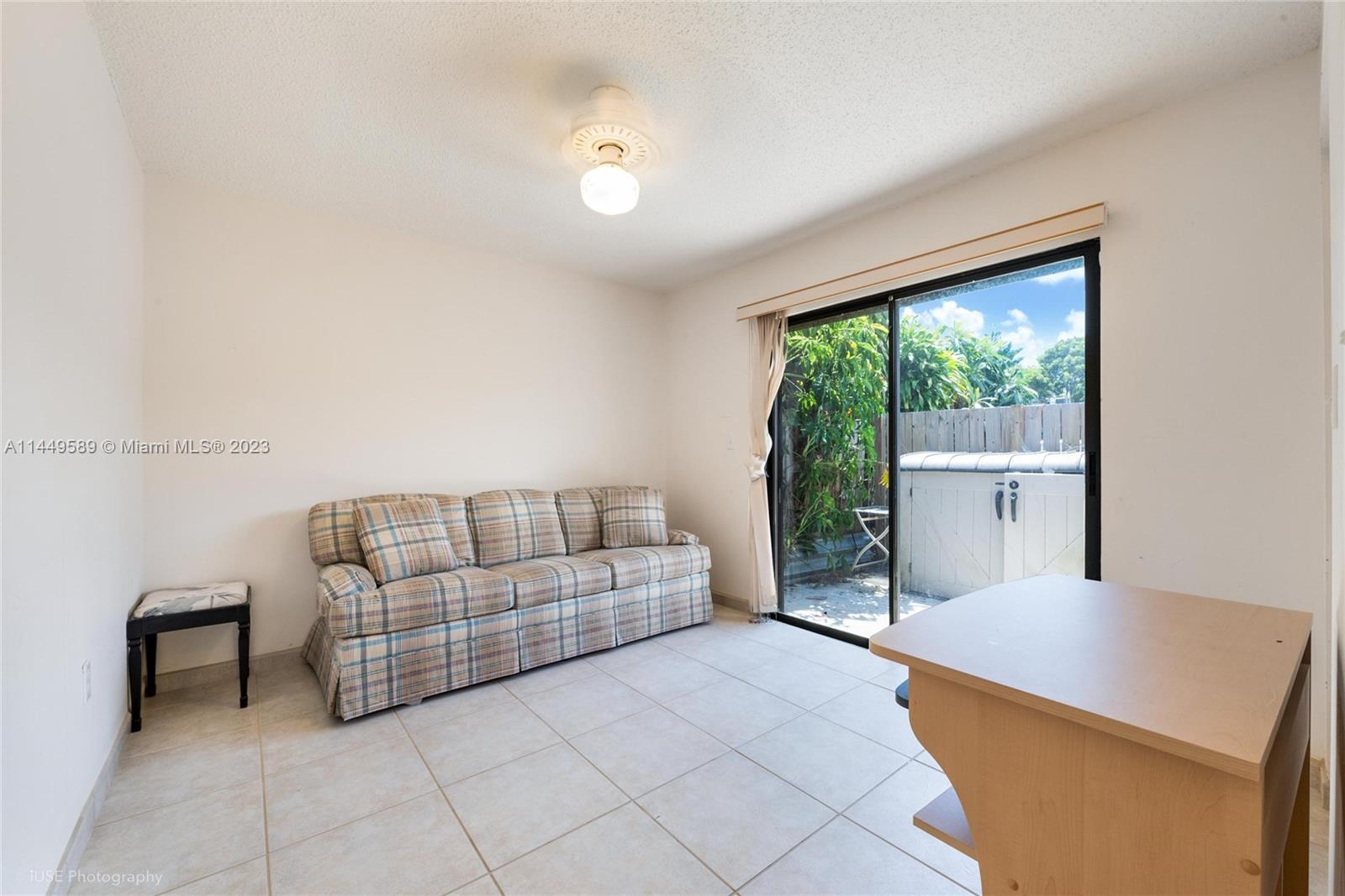 9208 Southwest 132nd Street Miami, FL 33176 - Photo 9 of 15 a living room with furniture and a large window
