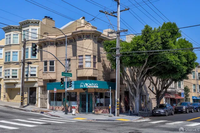 a front view of a building with street view