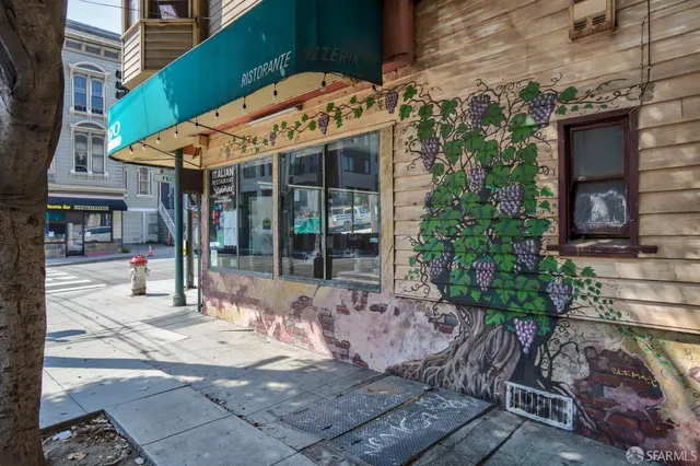 a view of a building with sitting area