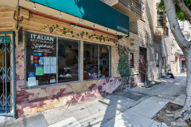 a view of a building with sitting area
