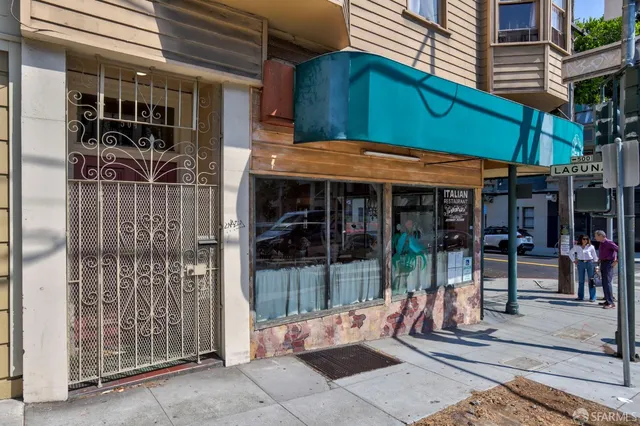 a view of a cafe with sitting area