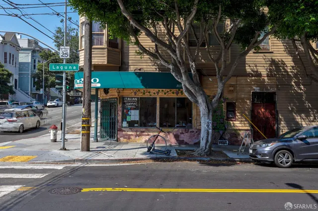 a view of a street with cars