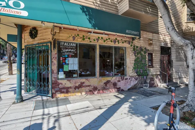 a view of a cafe with sitting area