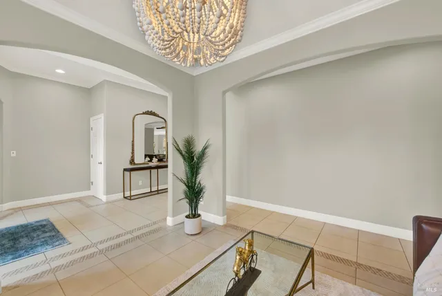 a kitchen with stainless steel appliances kitchen island granite countertop a refrigerator and a stove top oven with wooden floor