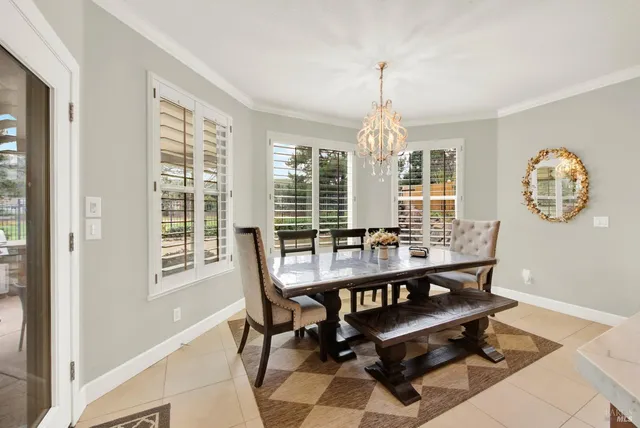 a spacious bathroom with a double vanity sink mirror and bathtub