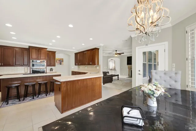 a spacious bathroom with a double vanity sink a mirror and a bathtub