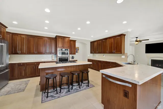 a en suite bathroom with a granite countertop sink and a mirror