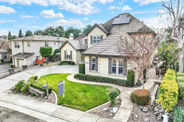 an outdoor space with furniture and garden