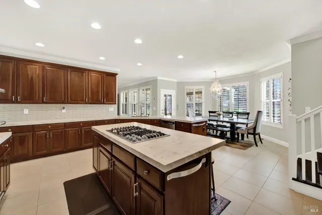 a bedroom with a bed and a wall painting