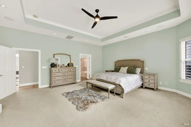 a view of living room with wooden floor and flat screen tv