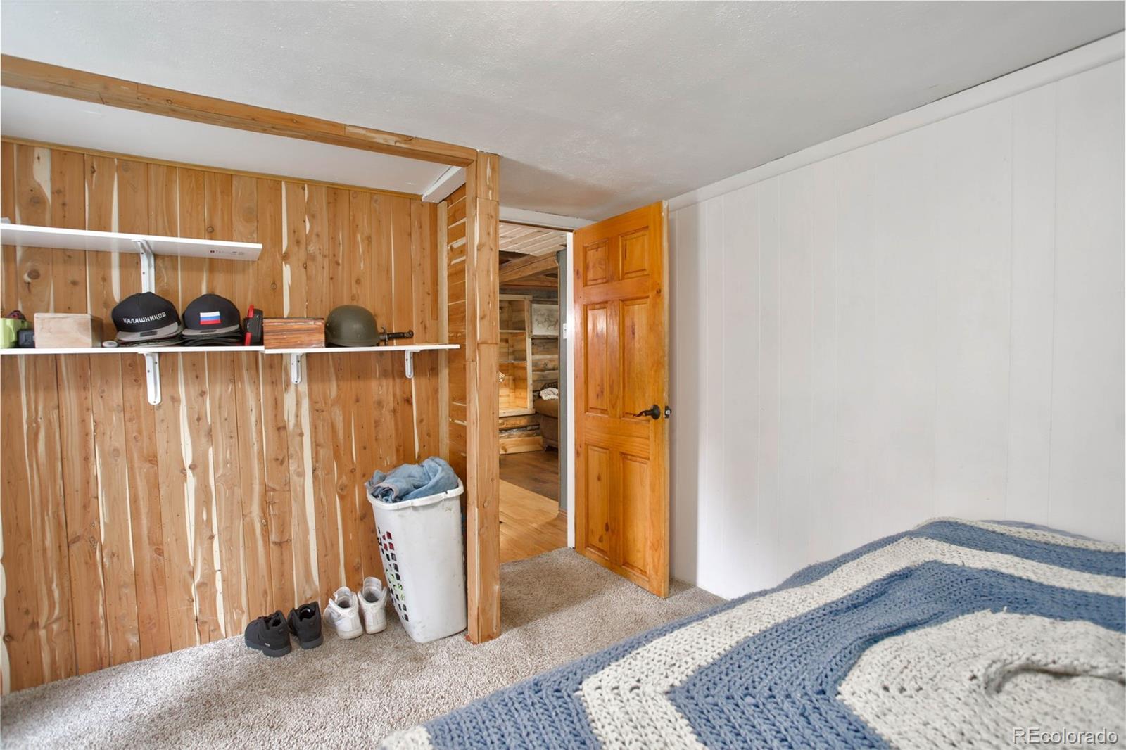 9399 Granzella Road Morrison, CO 80465 - Photo 21 of 41 a view of an entryway with wooden floor