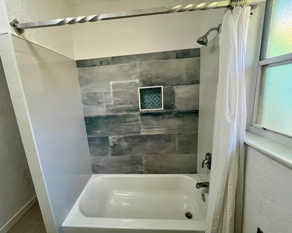 a bathroom with a bath tub