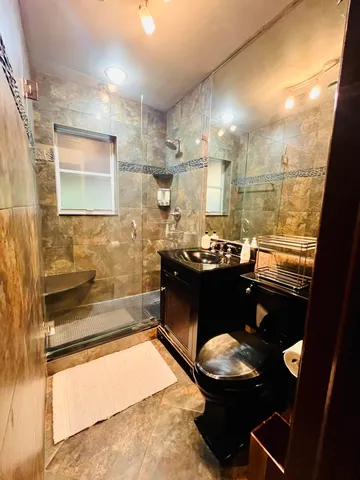 a bathroom with a bathtub and a sink