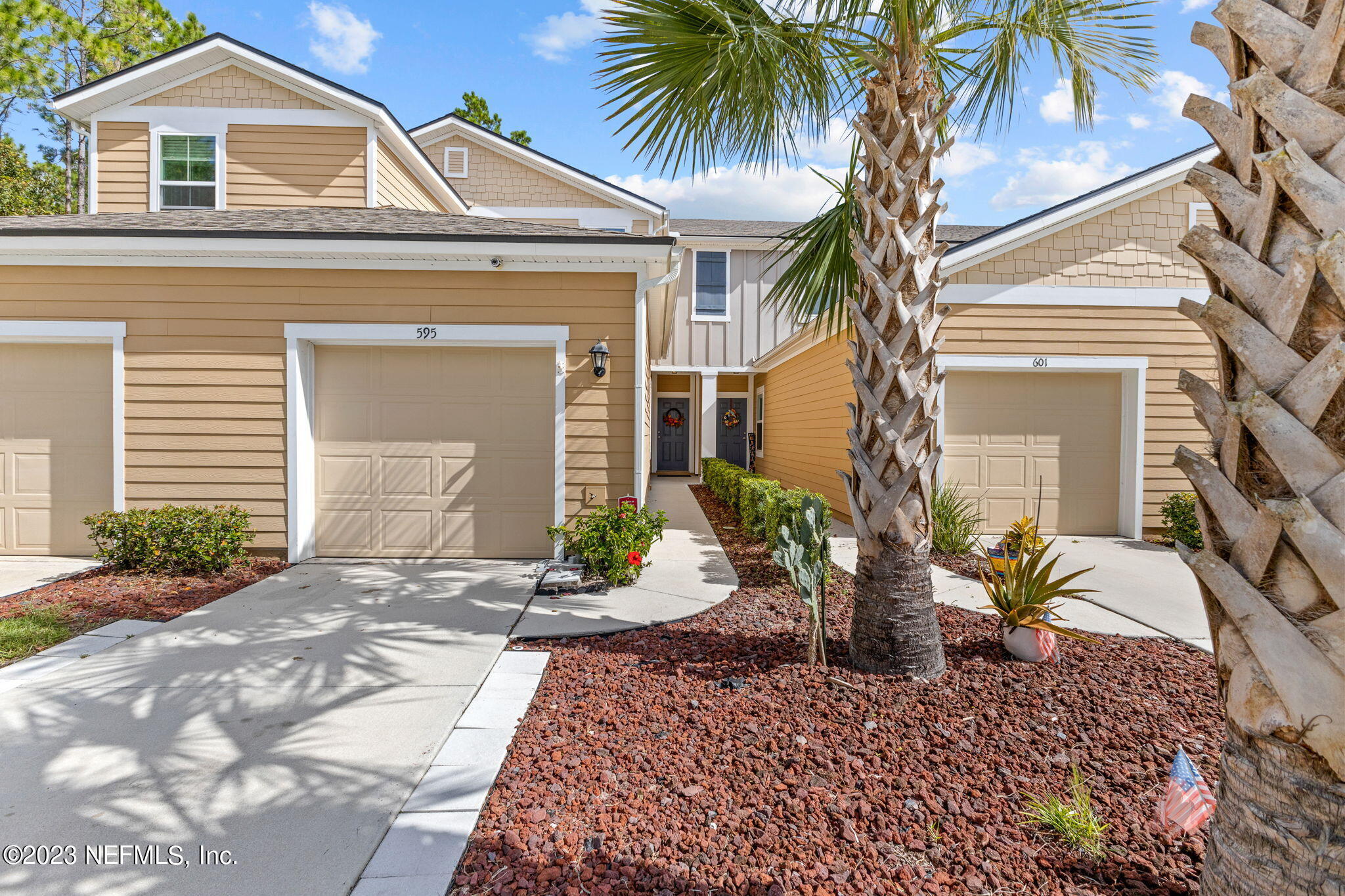 595 Servia Drive St. Johns, FL 32259 - Photo 1 of 56 a front view of a house with garden