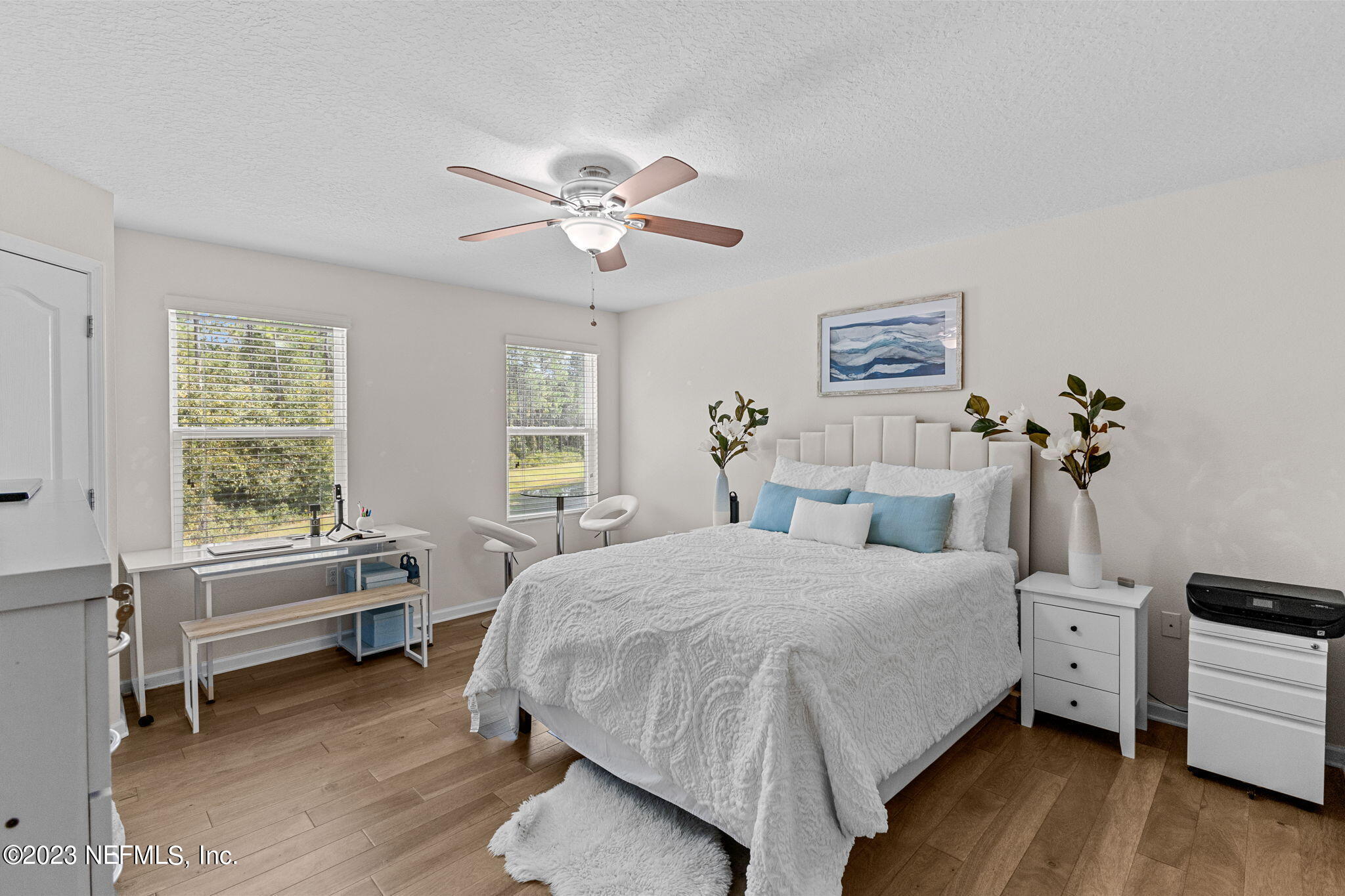 595 Servia Drive St. Johns, FL 32259 - Photo 18 of 56 a bedroom with a bed and a chandelier