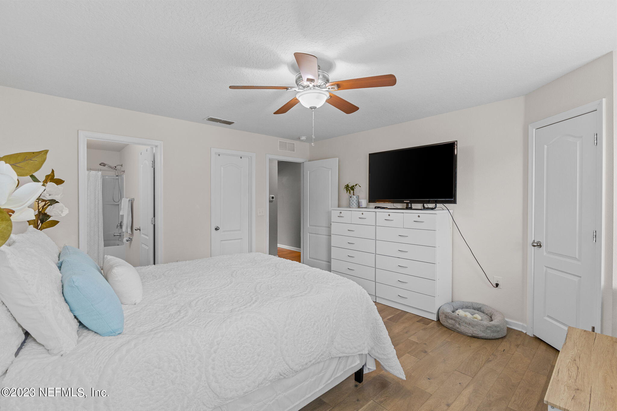 595 Servia Drive St. Johns, FL 32259 - Photo 20 of 56 a bedroom with a bed and a flat screen tv