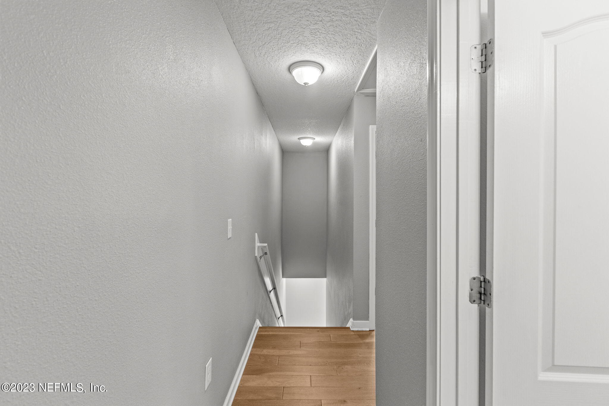 595 Servia Drive St. Johns, FL 32259 - Photo 26 of 56 a view of a hallway with wooden floor