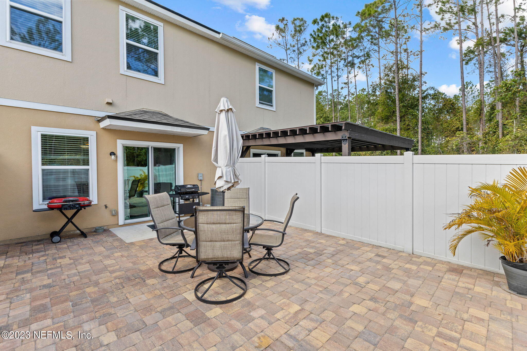 595 Servia Drive St. Johns, FL 32259 - Photo 27 of 56 a view of a dinning table and chairs in patio of the house