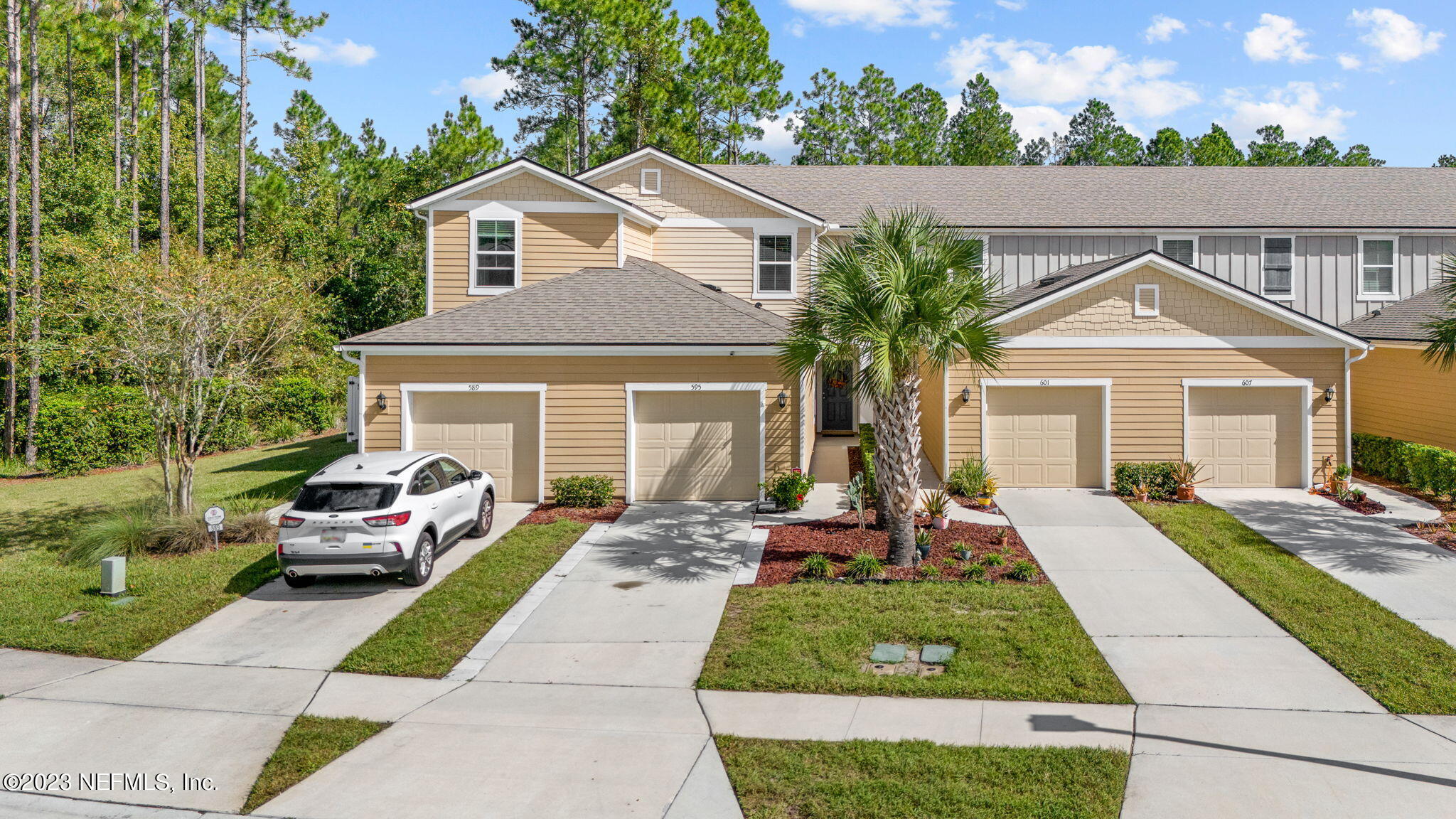 595 Servia Drive St. Johns, FL 32259 - Photo 3 of 56 a front view of a house with a yard