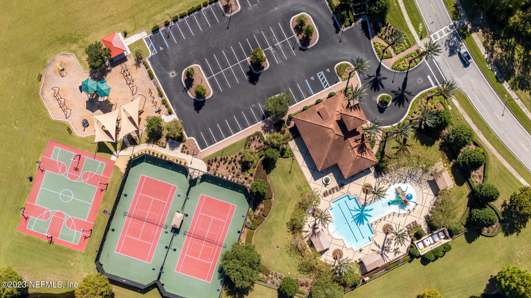 595 Servia Drive St. Johns, FL 32259 - Photo 40 of 56 an aerial view of a house with a swimming pool and outdoor seating