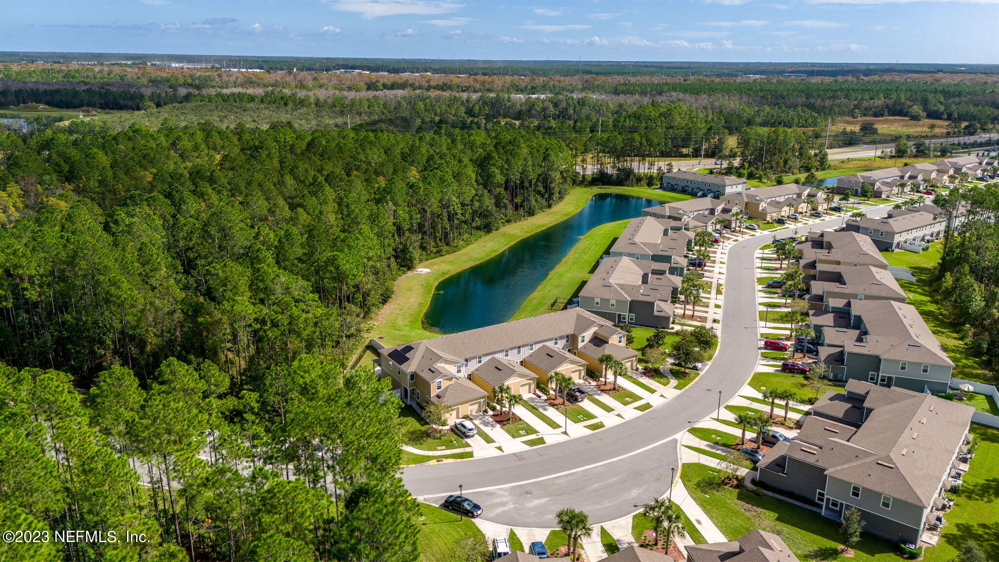 595 Servia Drive St. Johns, FL 32259 - Photo 51 of 56 an aerial view of a house with a garden and lake view