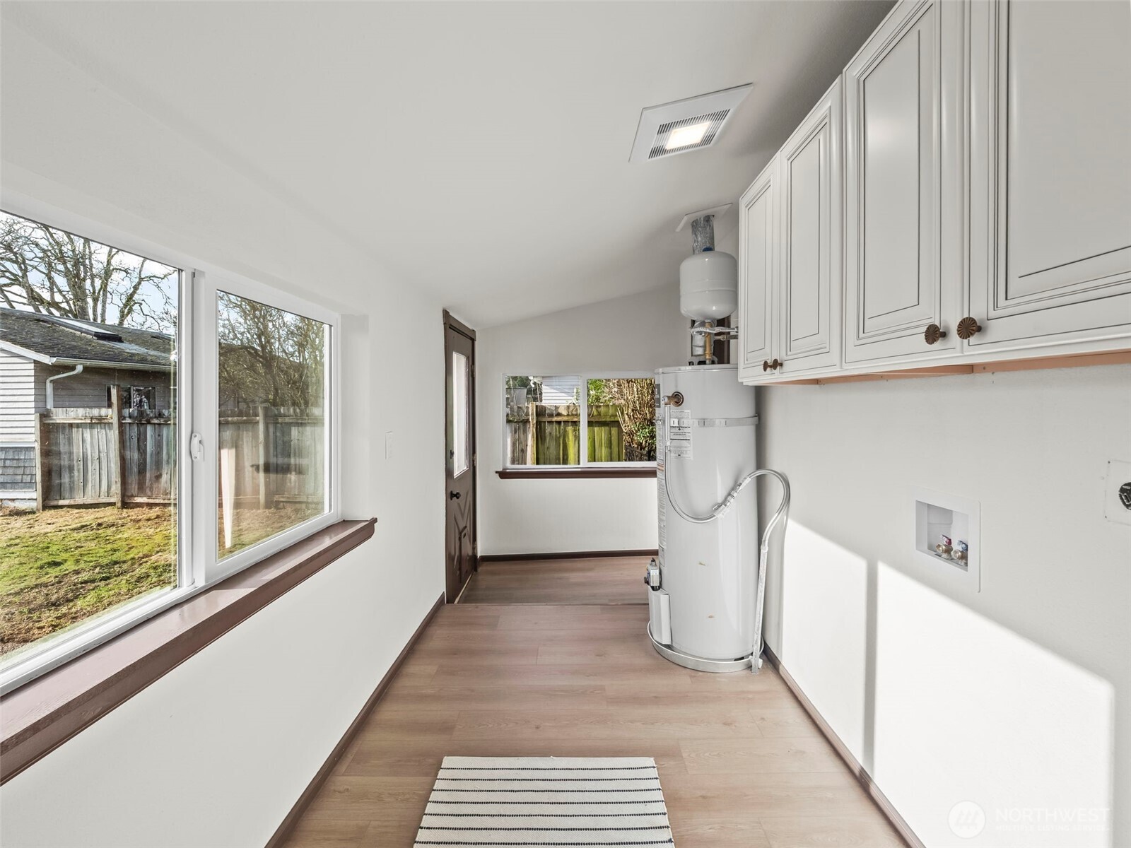 504 Dupont Avenue DuPont, WA 98327 - Photo 28 of 39 a view of a refrigerator in kitchen and wooden floor