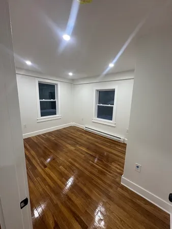 a room with a bed and a flat screen tv