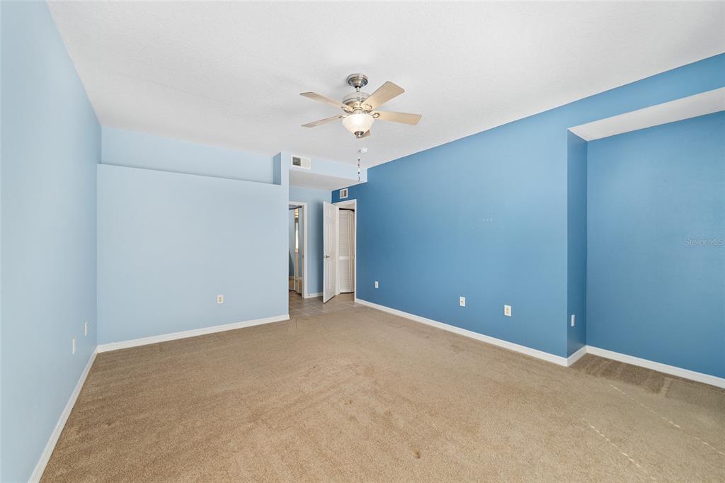 5427 Compass Point, Unit 1 Oxford, FL 34484 - Photo 23 of 51 a view of an empty room with a ceiling fan