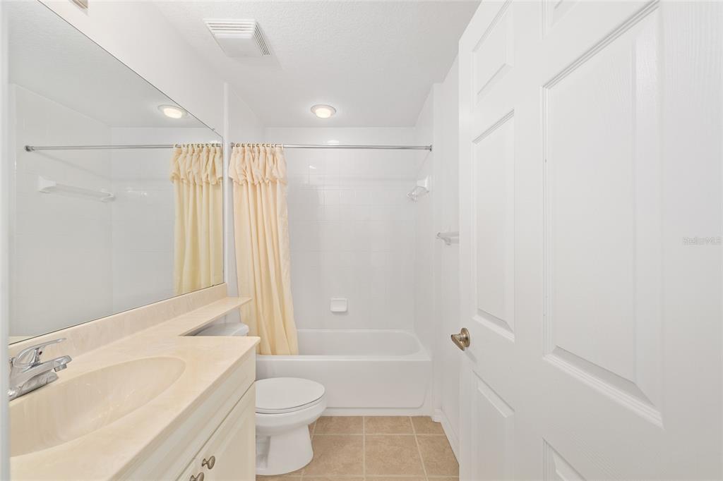 5427 Compass Point, Unit 1 Oxford, FL 34484 - Photo 29 of 51 a bathroom with a shower a toilet and a sink