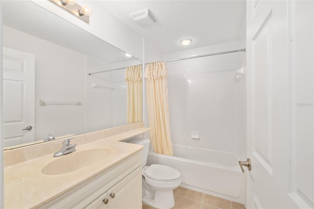 5427 Compass Point, Unit 1 Oxford, FL 34484 - Photo 30 of 51 a bathroom with a sink a toilet and shower